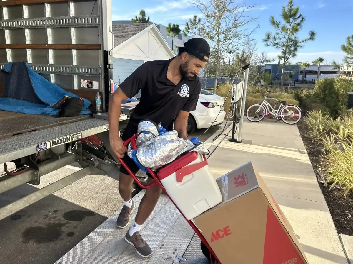 Happy 2 Help Moving crew carefully loading furniture